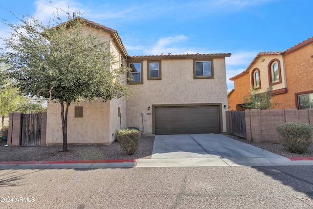 mediterranean / spanish-style home featuring a garage