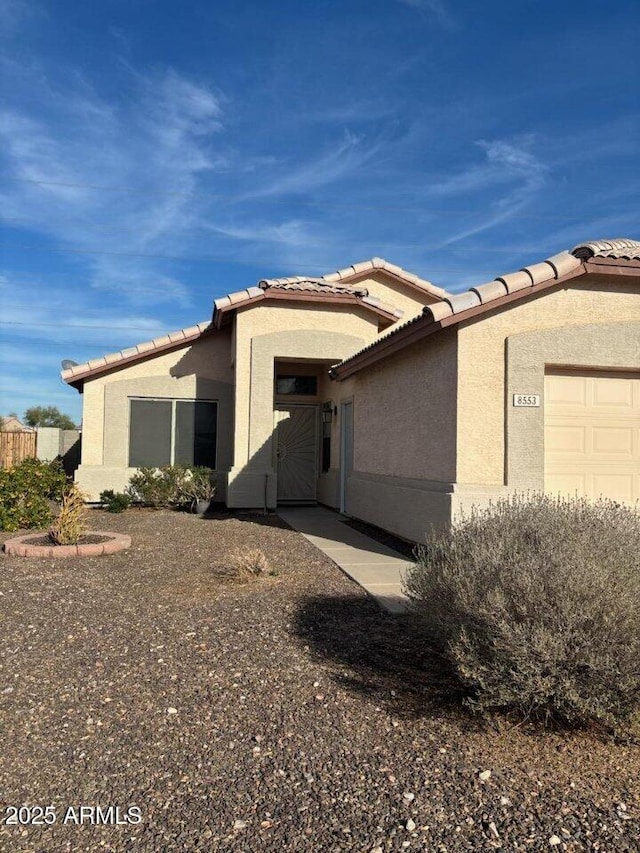 view of front of property featuring a garage