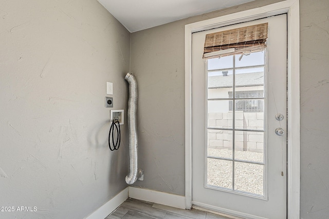laundry view of baseboards