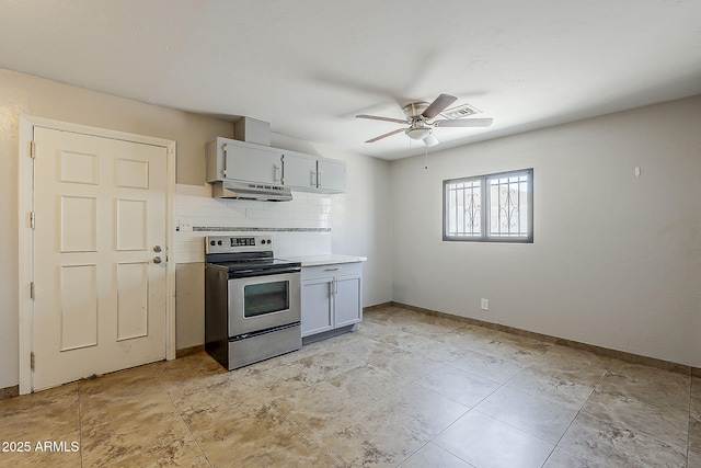 kitchen with stainless steel range with electric stovetop, under cabinet range hood, a ceiling fan, baseboards, and backsplash