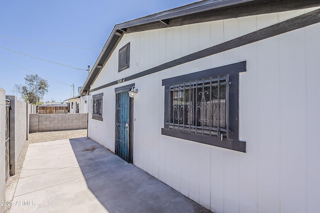 view of home's exterior with a fenced backyard and a patio area
