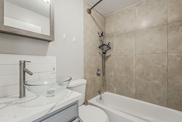 full bathroom with bathtub / shower combination, toilet, and vanity