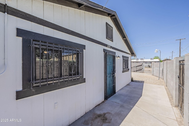 view of home's exterior featuring fence and a patio