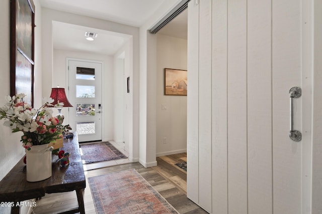 doorway to outside with dark hardwood / wood-style floors