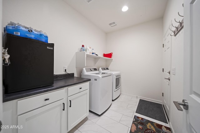 laundry room with washing machine and clothes dryer