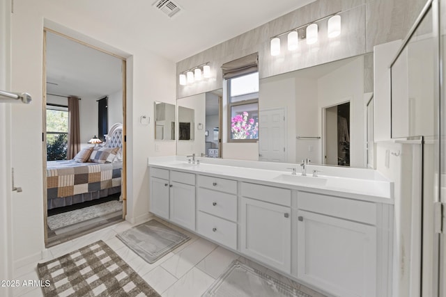 bathroom with vanity and tile patterned flooring