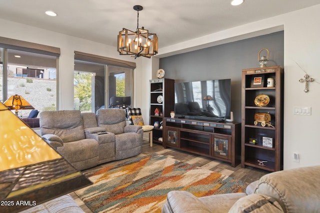 living room featuring an inviting chandelier and hardwood / wood-style flooring