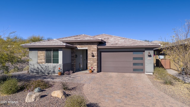 prairie-style home featuring a garage