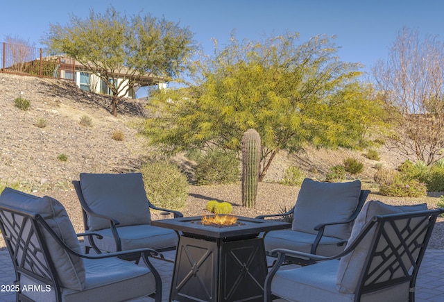 view of patio with an outdoor fire pit