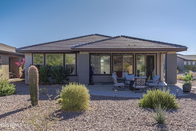 rear view of property with a patio