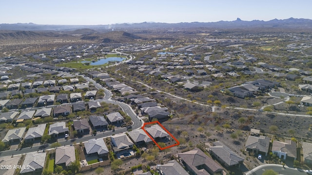 bird's eye view with a water and mountain view