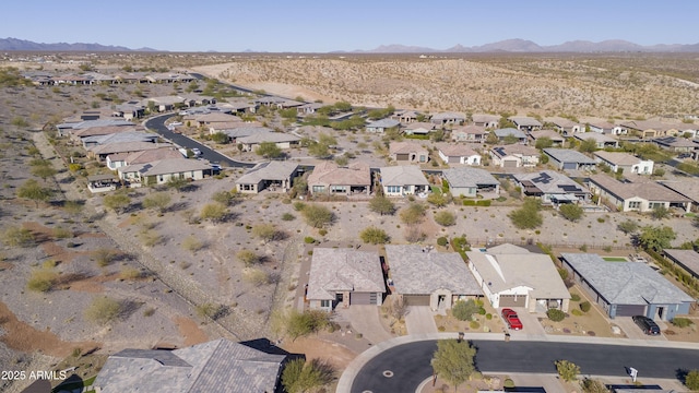 birds eye view of property with a mountain view