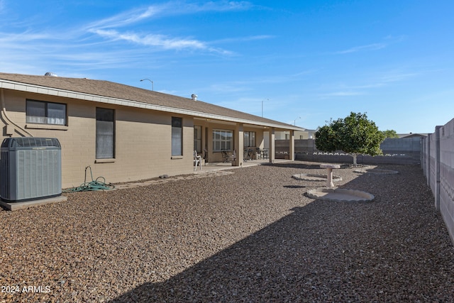 back of property featuring a patio area and central air condition unit