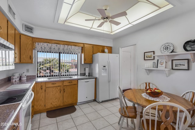 kitchen with ceiling fan, white appliances, sink, and light tile patterned floors