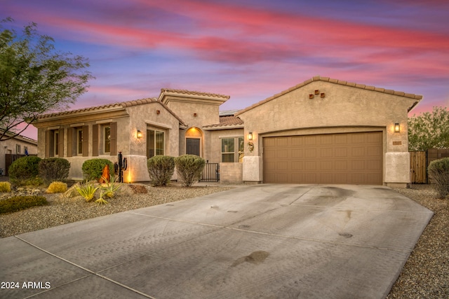 mediterranean / spanish-style house featuring a garage