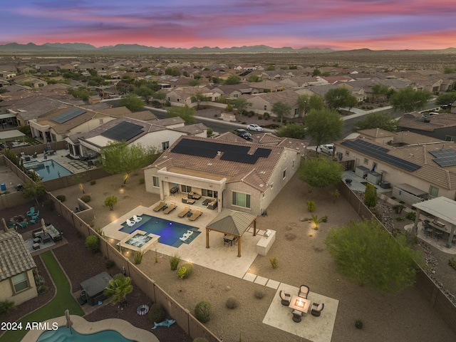 15201 S 183rd Dr, Goodyear, AZ 85338 - aerial view at dusk with a residential view and a mountain view