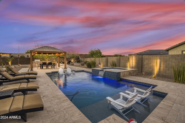 15201 S 183rd Dr, Goodyear, AZ 85338 - view of swimming pool featuring a patio, a fenced in pool, a fenced backyard, a gazebo, and an in ground hot tub