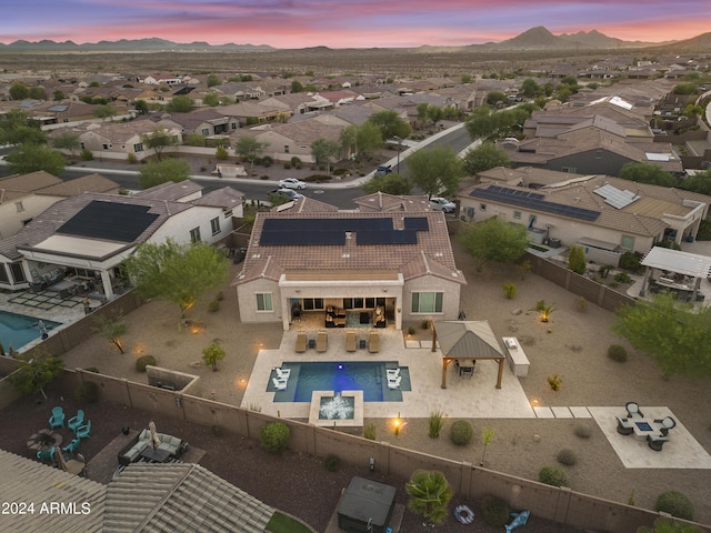 15201 S 183rd Dr, Goodyear, AZ 85338 - aerial view at dusk featuring a residential view and a mountain view