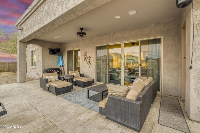 patio terrace at dusk with an outdoor hangout area