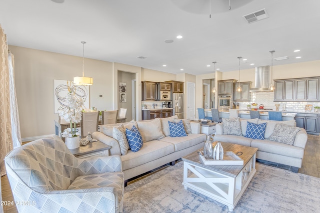 15201 S 183rd Dr, Goodyear, AZ 85338 - living room with wood finished floors, recessed lighting, and visible vents
