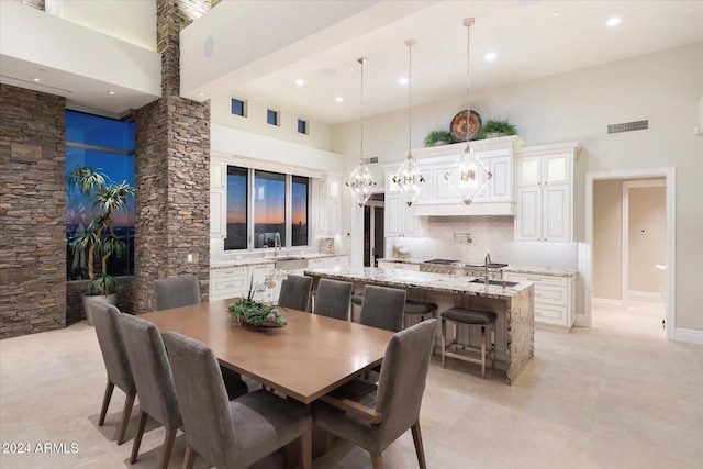 dining space featuring a high ceiling