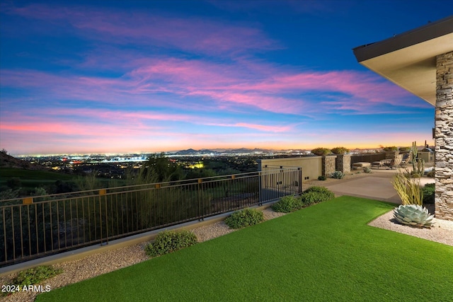 yard at dusk with a patio