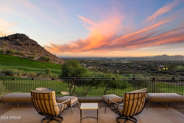 patio terrace at dusk with a mountain view