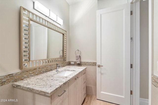 bathroom featuring wood-type flooring and vanity