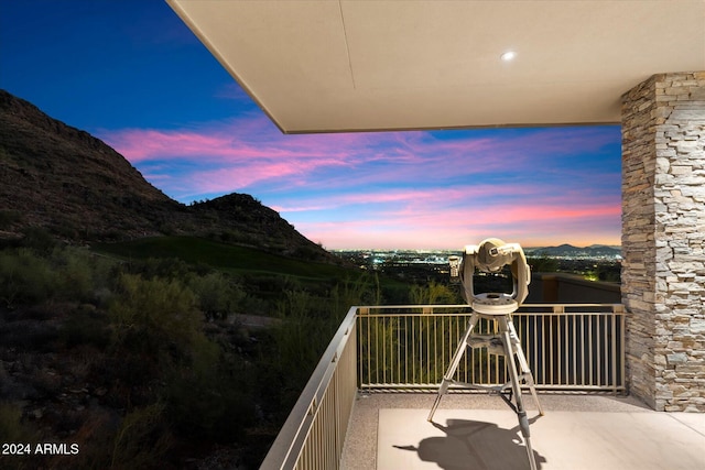 balcony at dusk with a mountain view