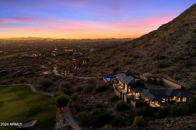 aerial view at dusk with a mountain view