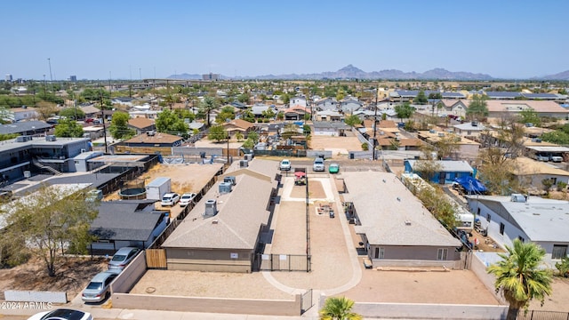 birds eye view of property featuring a mountain view