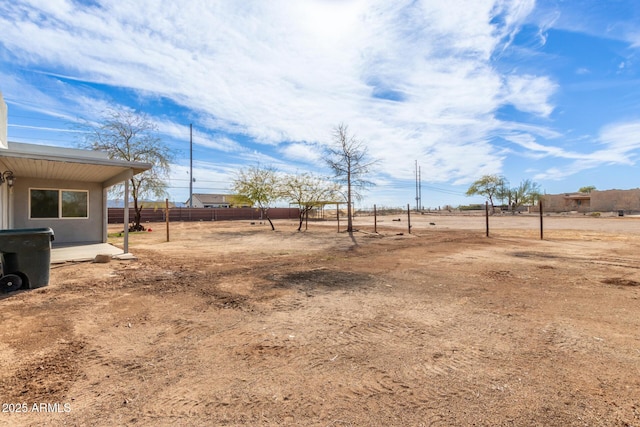 view of yard with a rural view