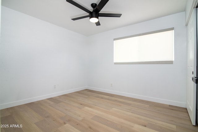 spare room featuring ceiling fan and light hardwood / wood-style flooring