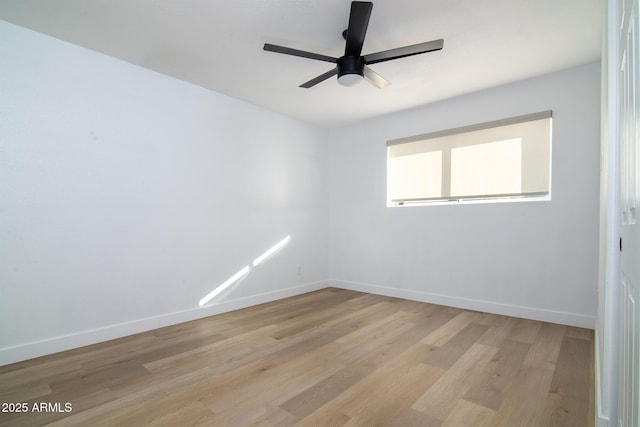 spare room with ceiling fan and light hardwood / wood-style flooring