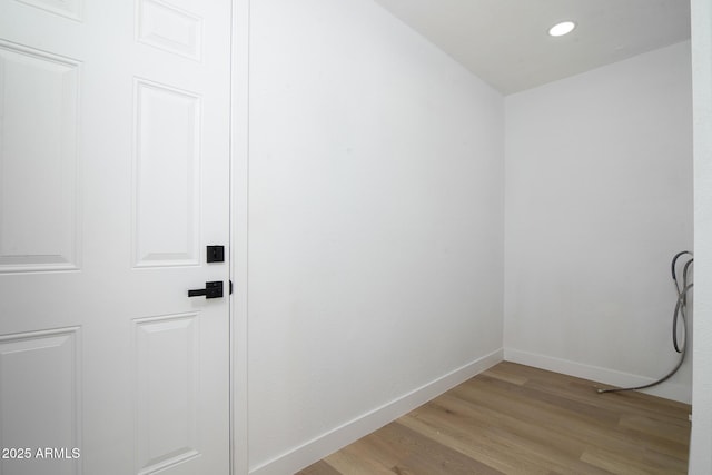 laundry room featuring light hardwood / wood-style floors