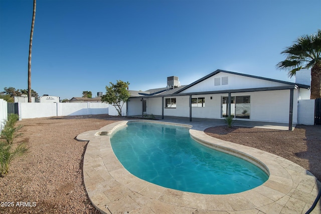 view of pool with cooling unit and a patio area