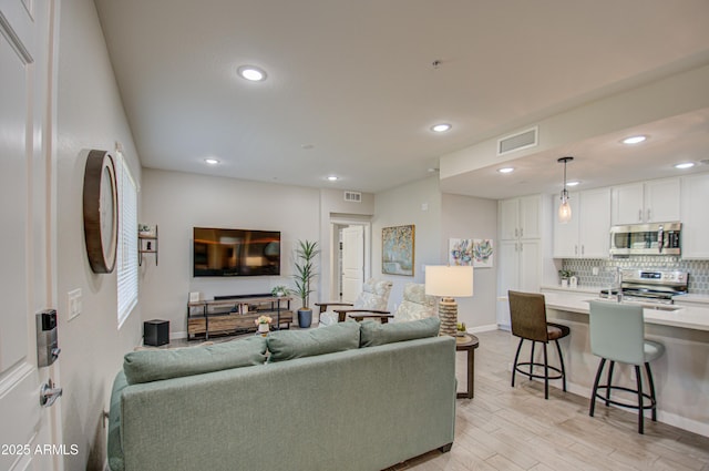 living room with light hardwood / wood-style floors