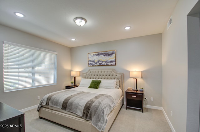 bedroom featuring light colored carpet