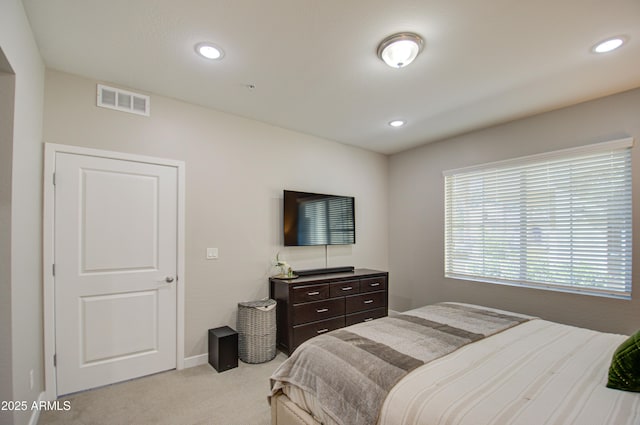 bedroom with light colored carpet