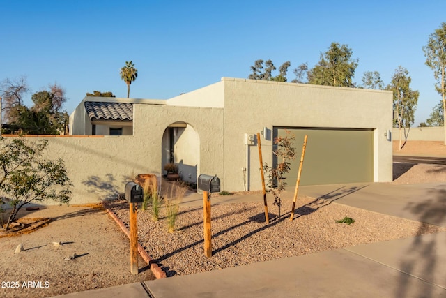 southwest-style home with a garage