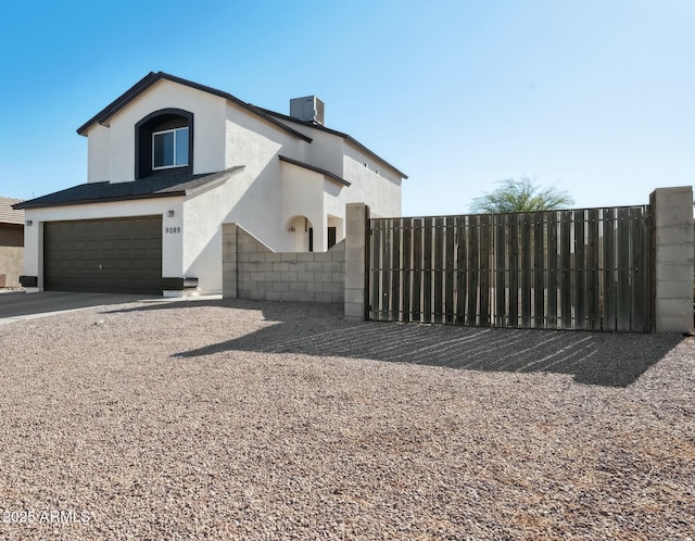 view of side of property featuring central AC unit and a garage