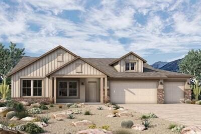 view of front facade featuring a mountain view and a garage