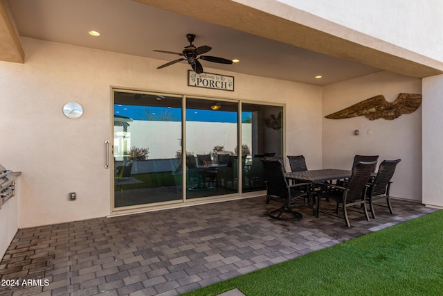 patio terrace at dusk with ceiling fan