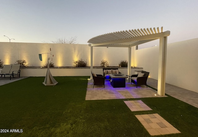 yard at dusk with a pergola, an outdoor hangout area, and a patio area