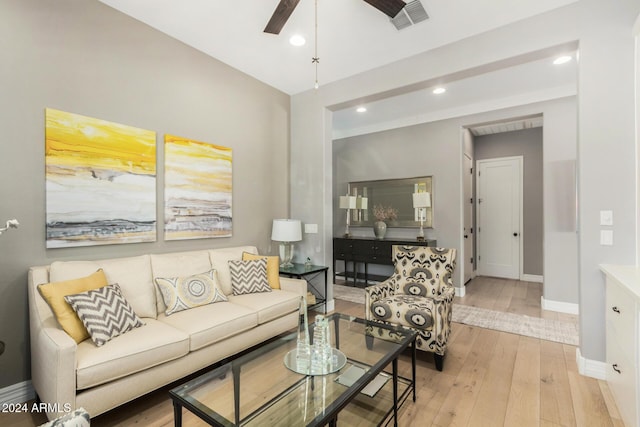 living room featuring light hardwood / wood-style flooring and ceiling fan