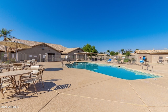 view of swimming pool with a patio area