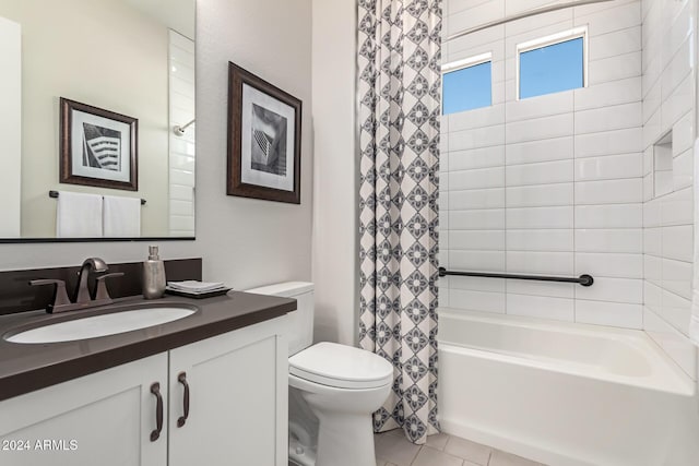 full bathroom featuring tile patterned floors, vanity, toilet, and shower / tub combo