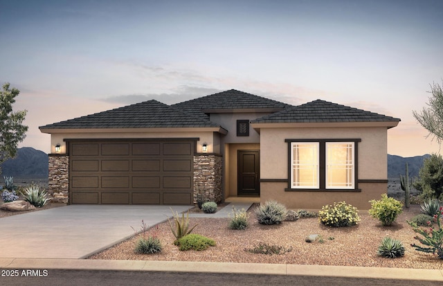 view of front of property with a garage and a mountain view