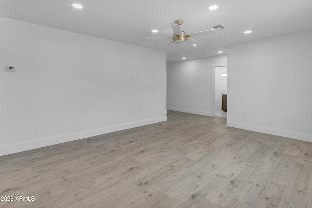 empty room featuring recessed lighting, a ceiling fan, baseboards, and light wood-style floors