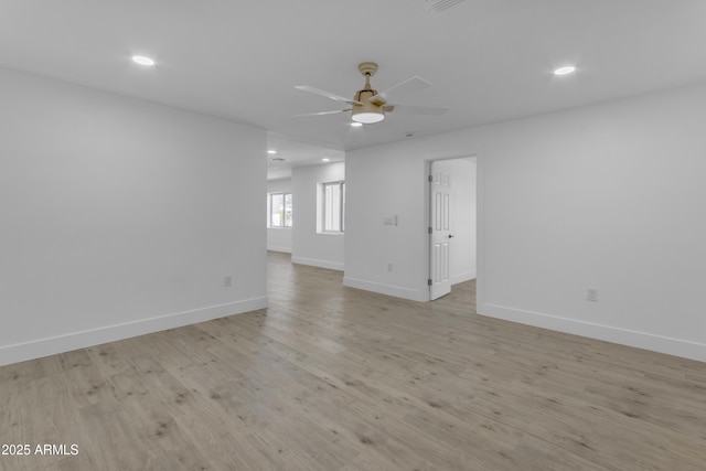 unfurnished room featuring ceiling fan, baseboards, recessed lighting, and light wood-style floors